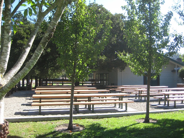 The Harvey West Clubhouse outside with new picnic tables